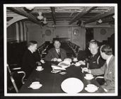 Sec. of Navy Frank Knox at table for tea 